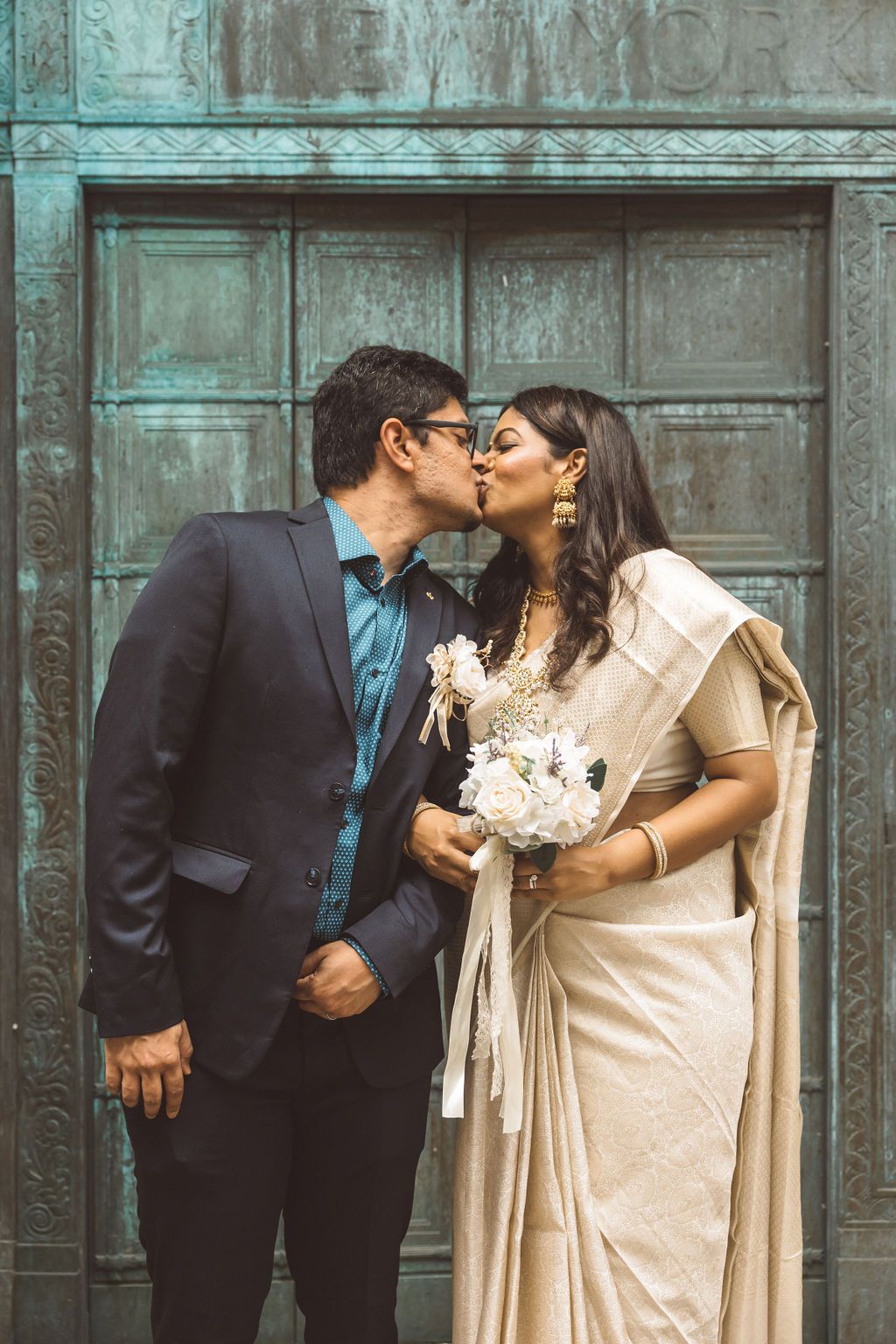 cute portrait of the newlyweds kissing