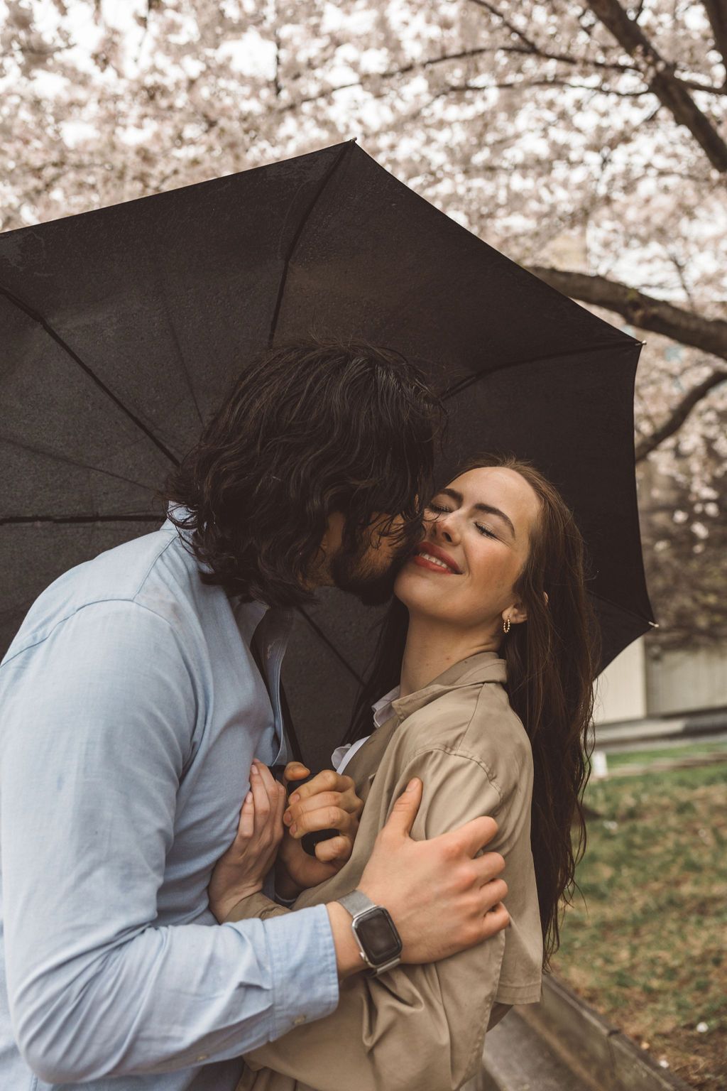 fiance kissing his fiance on the cheek during their photoshoot