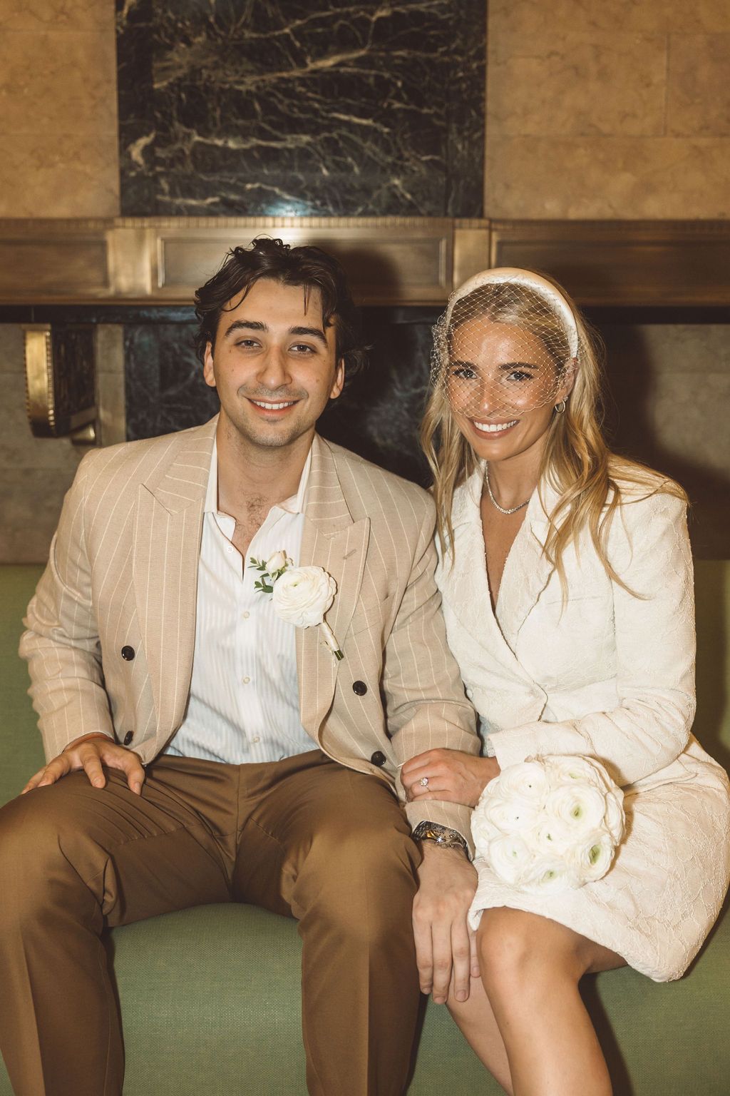 cute picture of the newlyweds smiling at the camera during their bridal photos