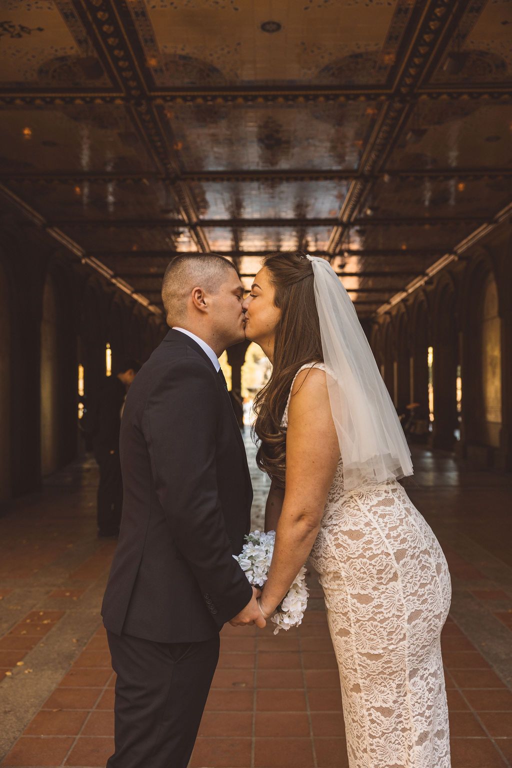 newly married couple kissing during their bridal photos