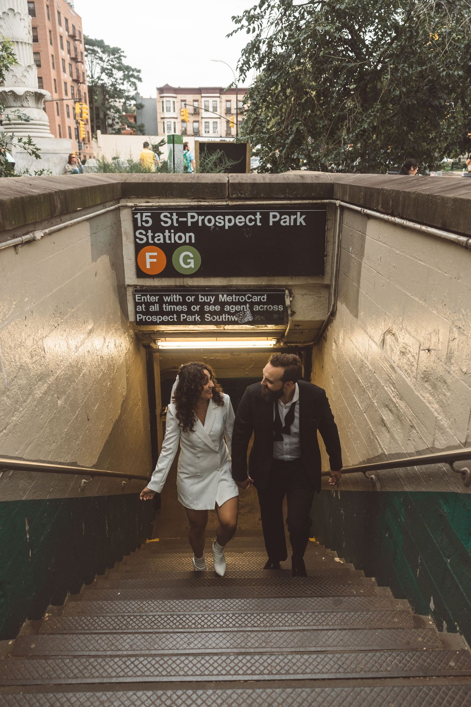 portrait of the newly engaged couple walking around NYC