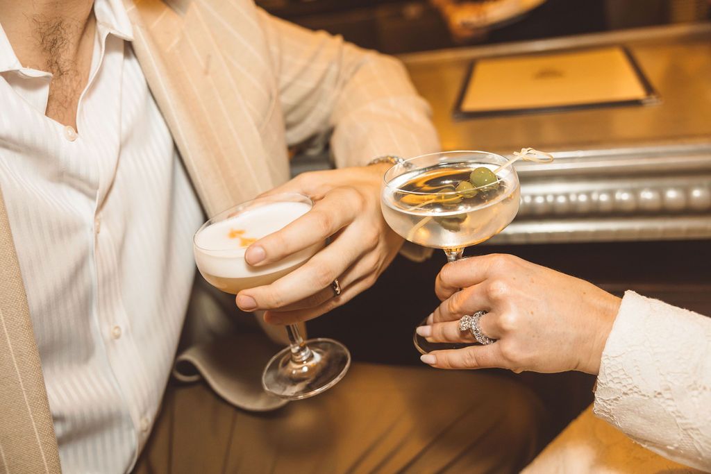couple celebrating their elopement with drinks