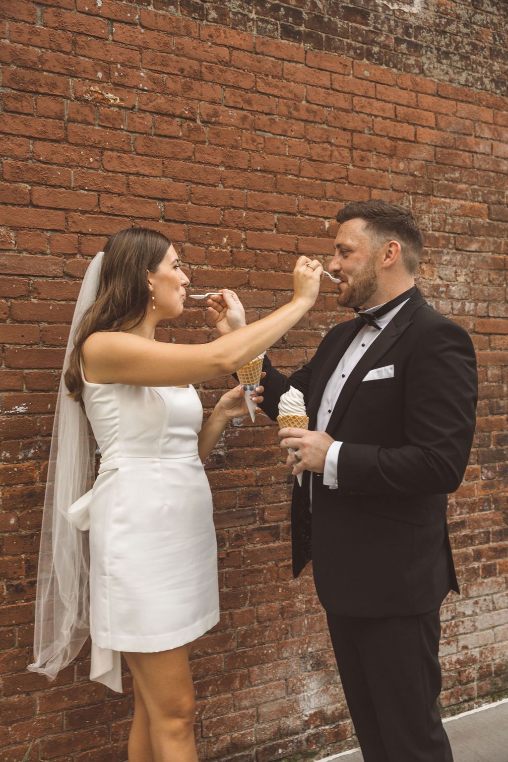 couple celebrating their elopement with ice cream