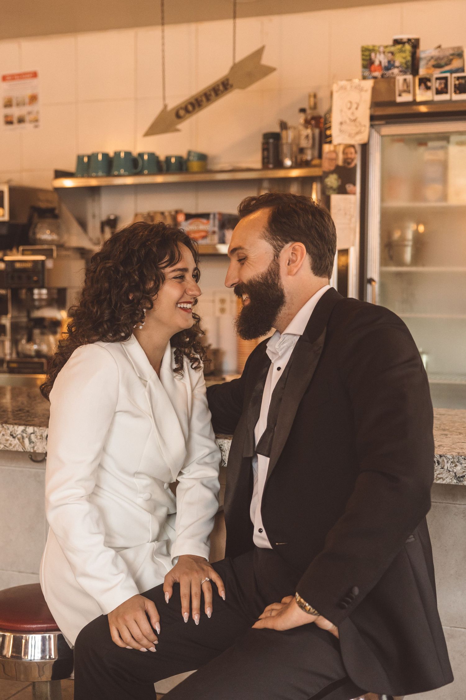 cute picture of the newly engaged couple smiling at each other