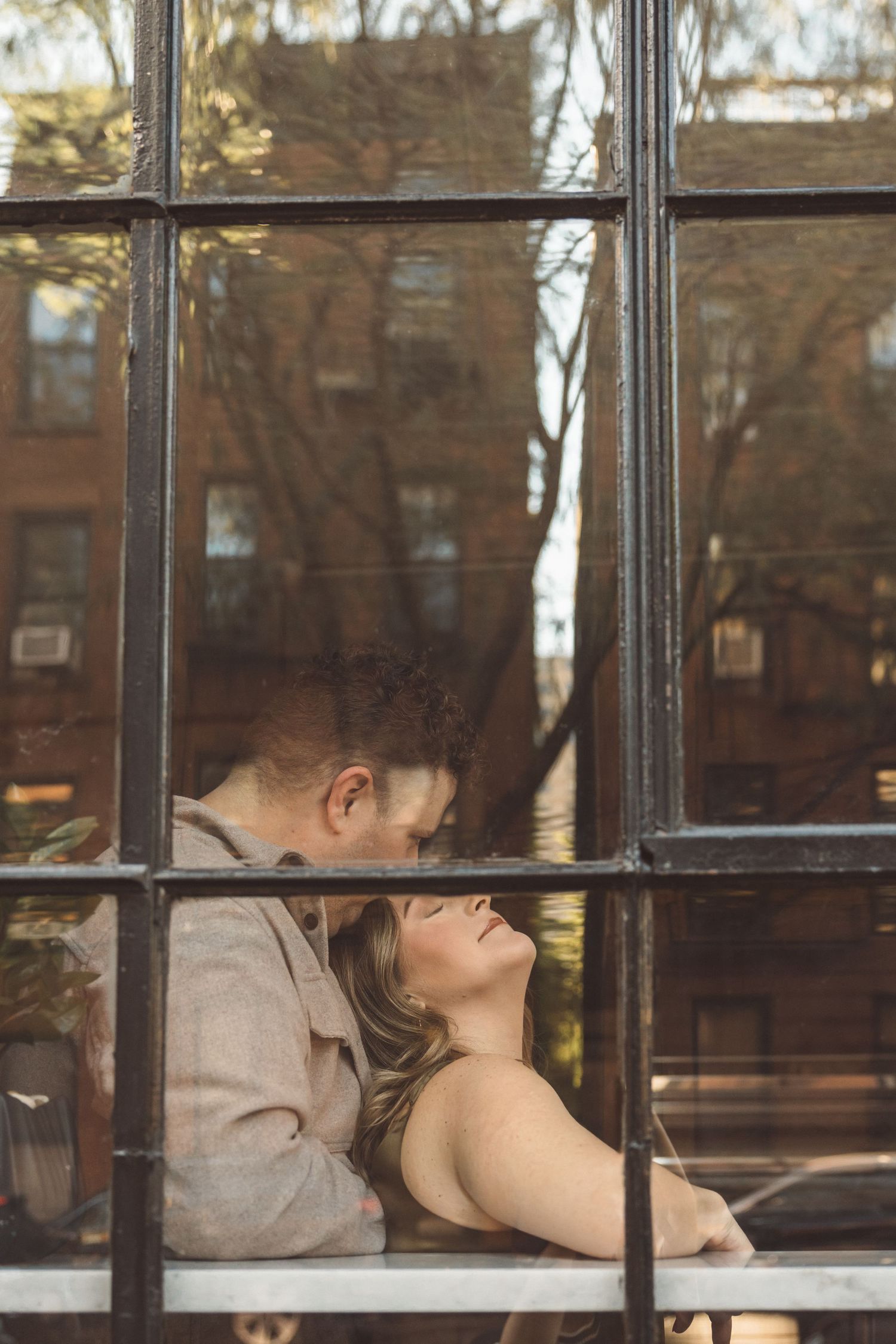 fiance kissing his fiance on the forehead