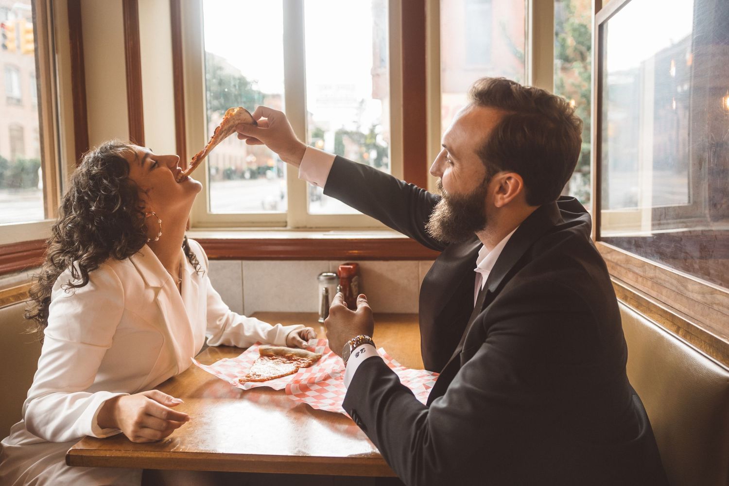 couple celebrating their engagement with pizza
