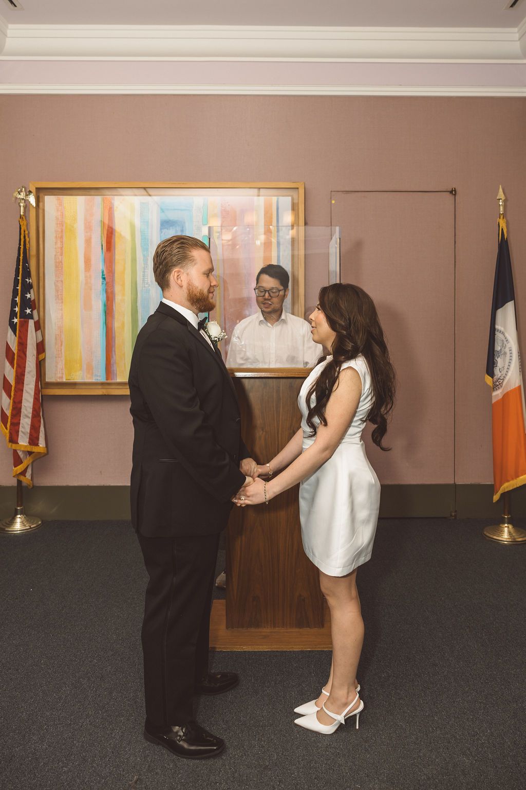 cute picture of the bride and groom holding hands