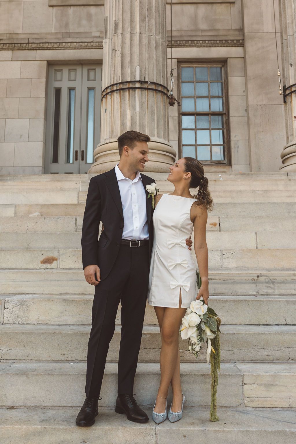 cute picture of the newlyweds smiling at each other