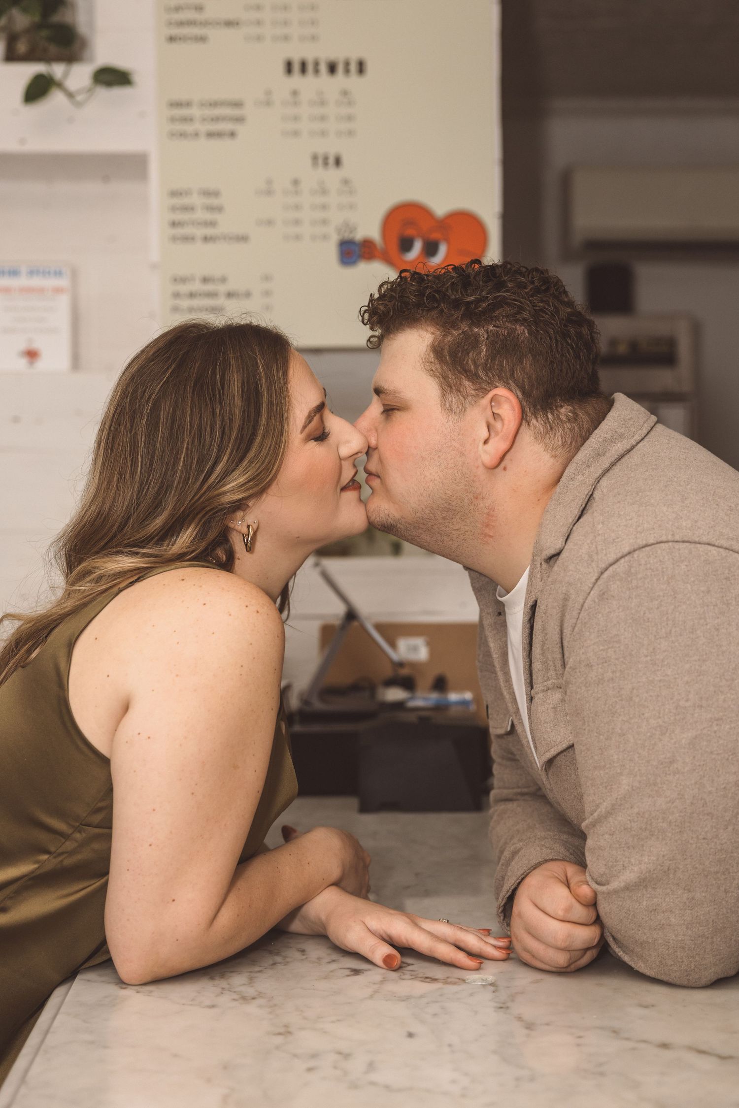cute picture of the newly engaged couple kissing