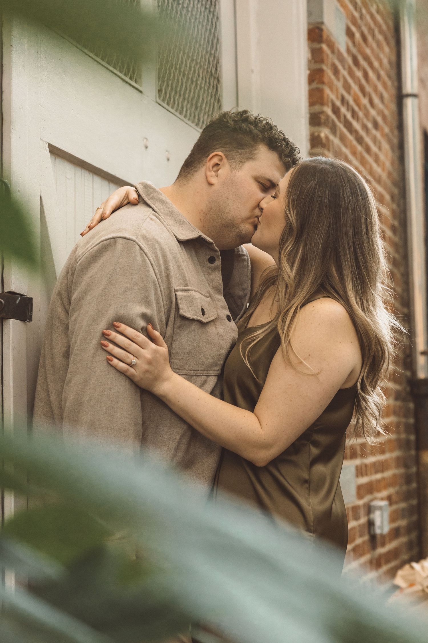couple kissing during their golden hour portraits