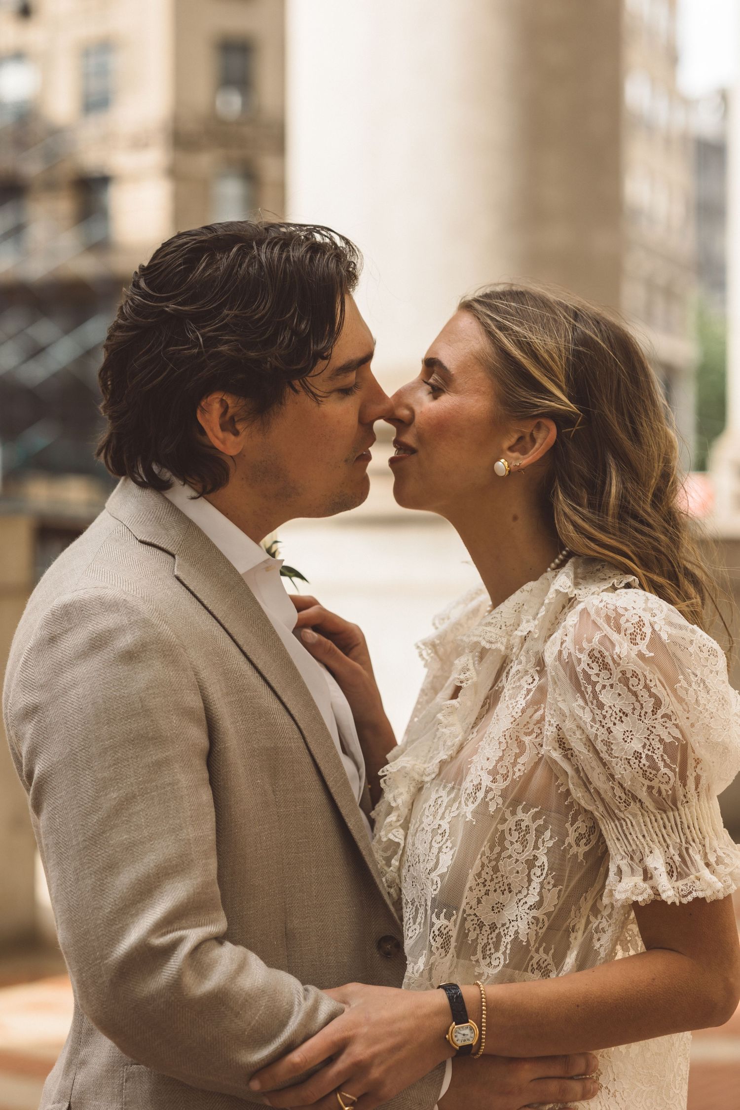 cute picture of the bride and groom smiling at each other during their photoshoot