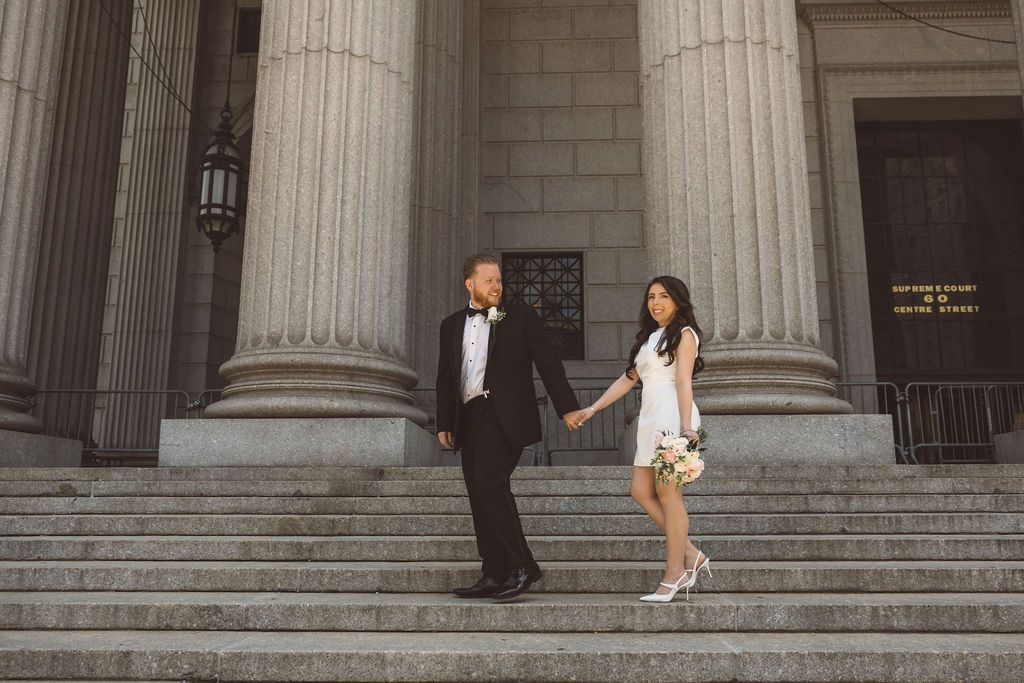 bride and groom holding hands during their bridal portraits