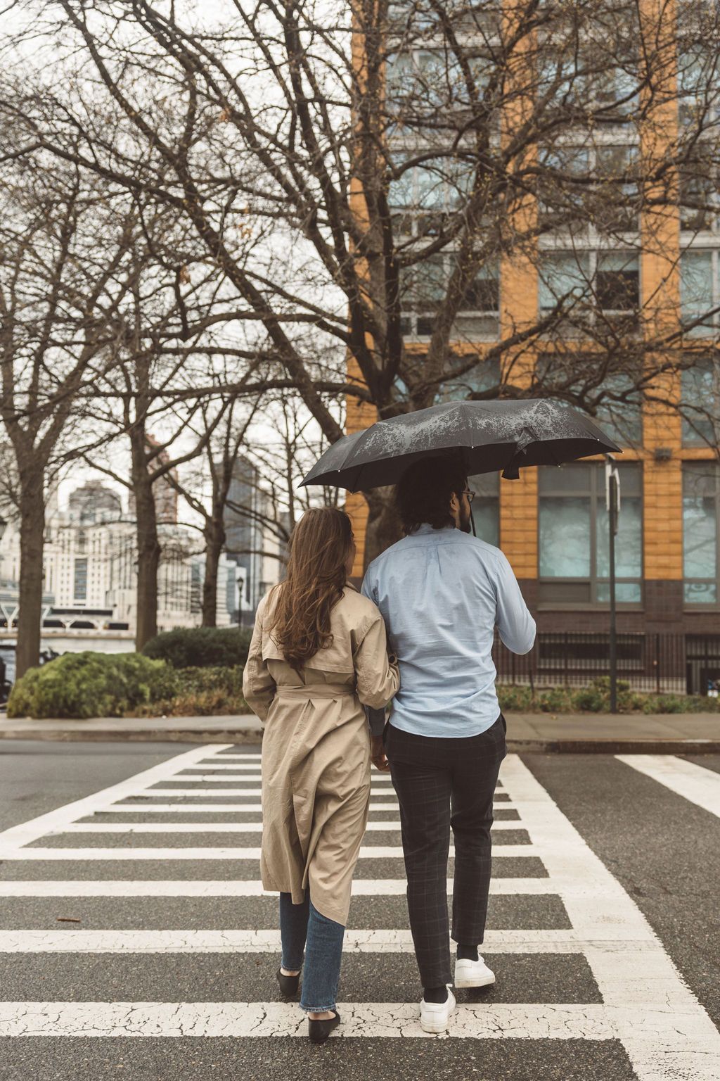 couple walking around ny during their photoshoot