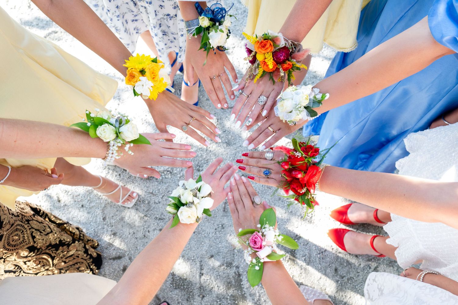 Group of girls showing their Bountiful Homecoming corsages in circle formation from above