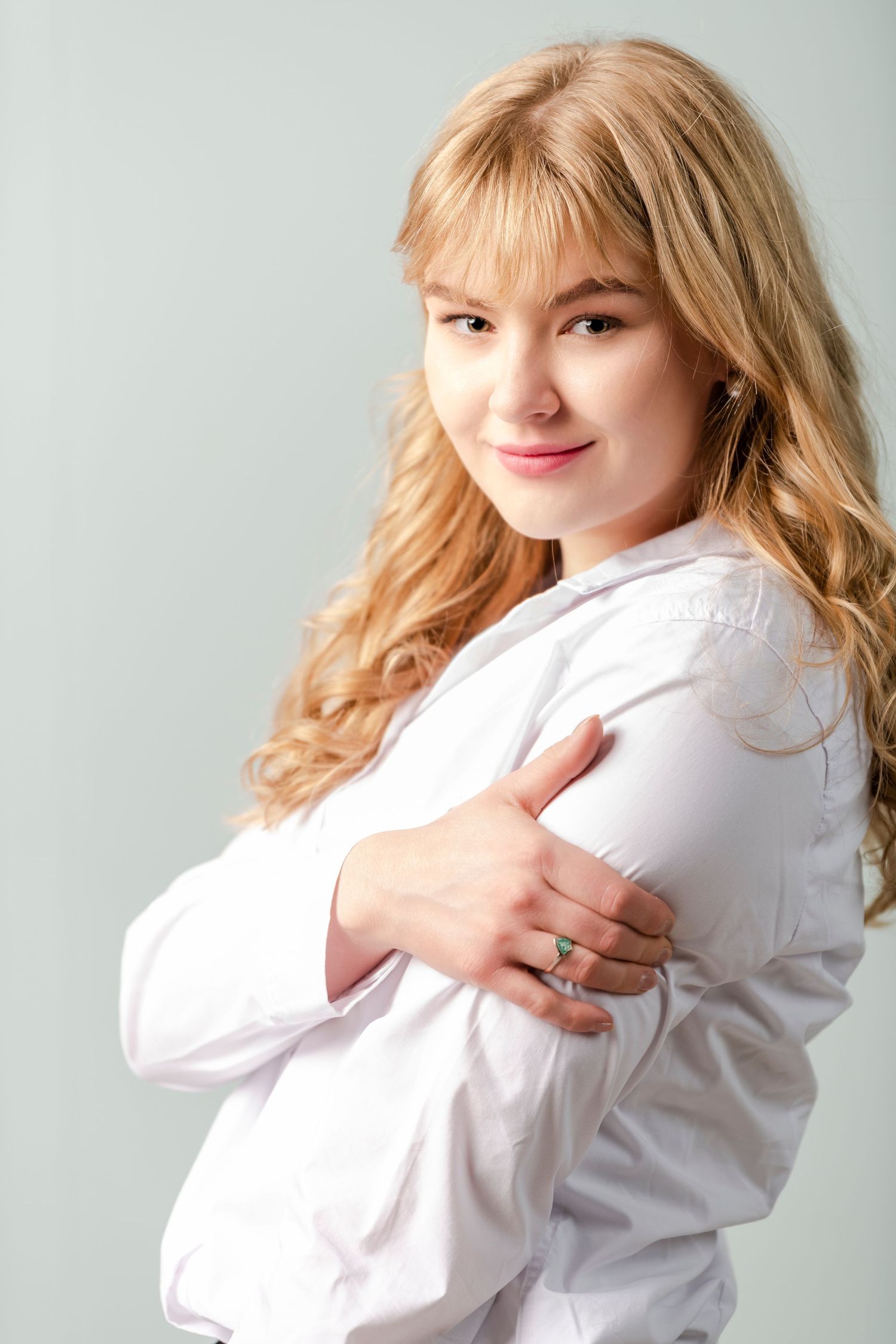 LDS missionary portrait of young woman in white shirt with clean studio background and soft lighting