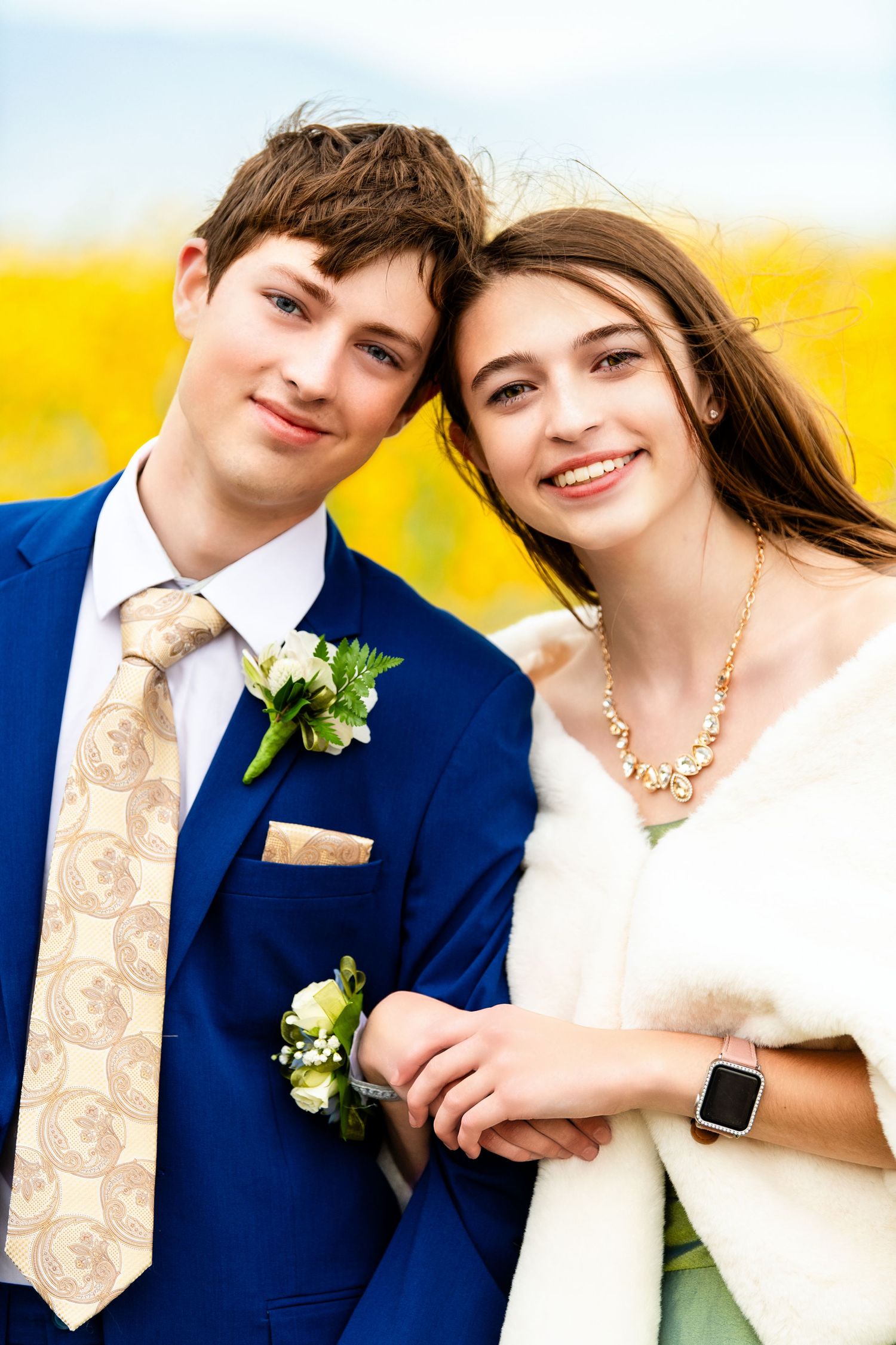 Close-up of Woods Cross homecoming couple smiling together in formal attire outdoors