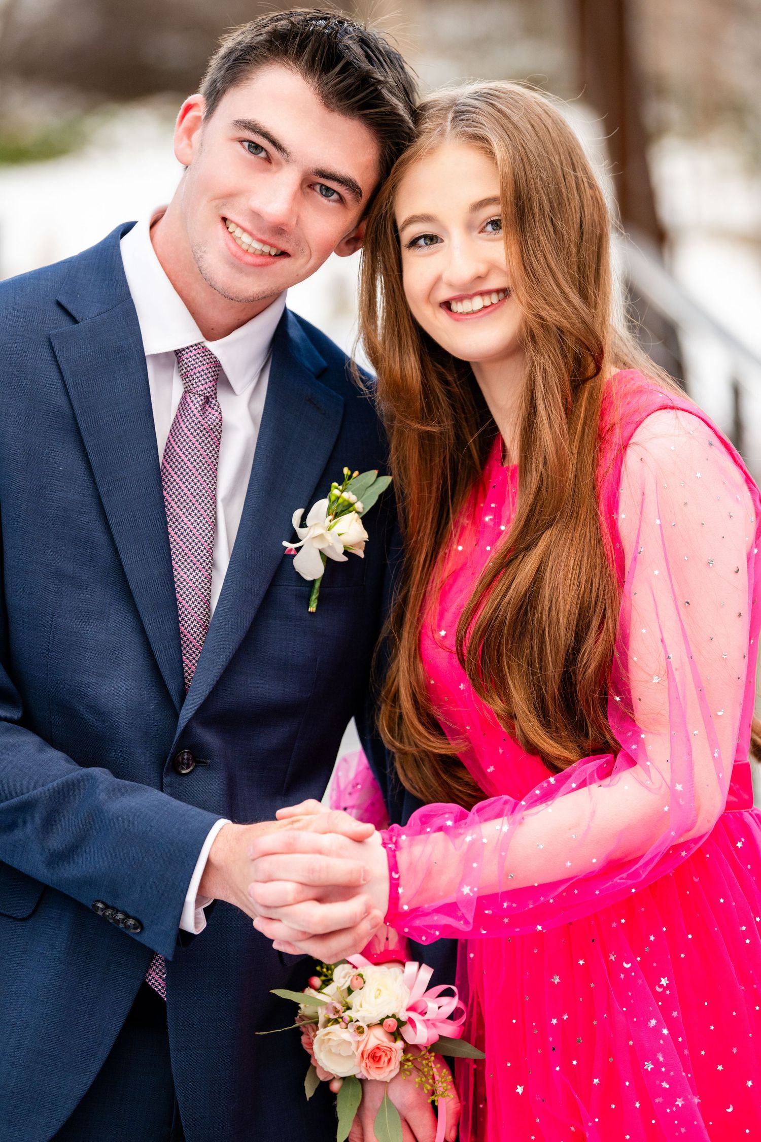 Woods Cross Sweethearts dance couple posing together smiling in formal attire outdoors