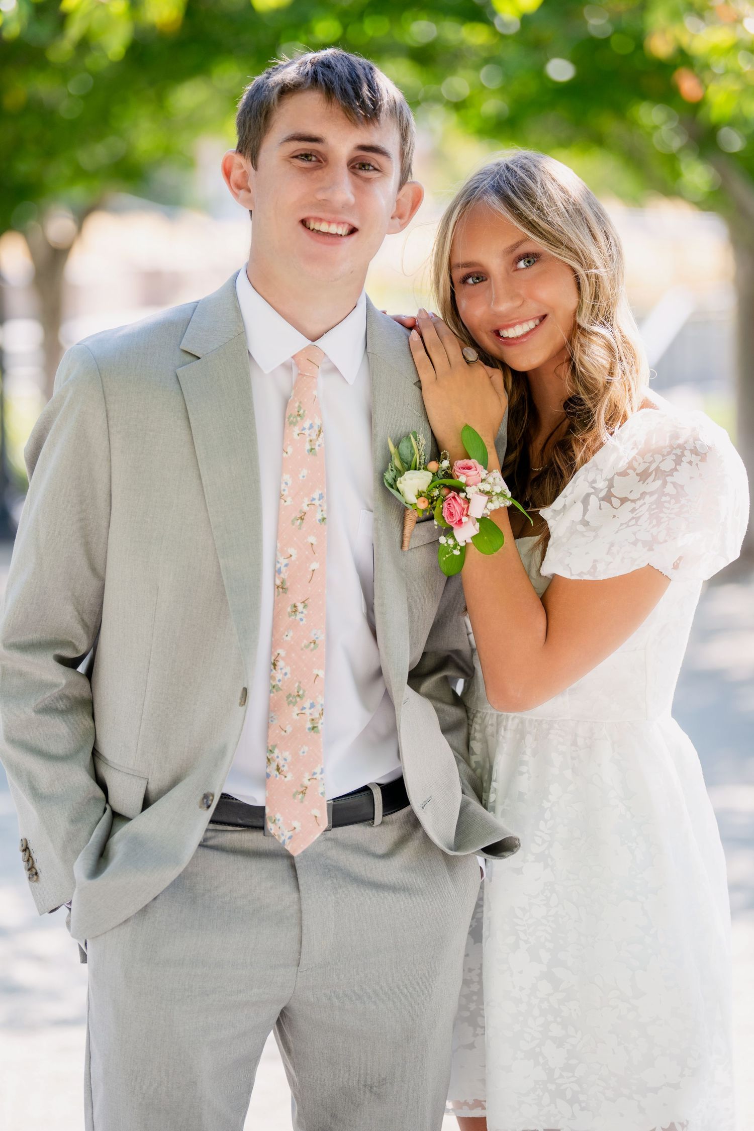 Bountiful High School Homecoming couple posing together in light outfits with soft natural light