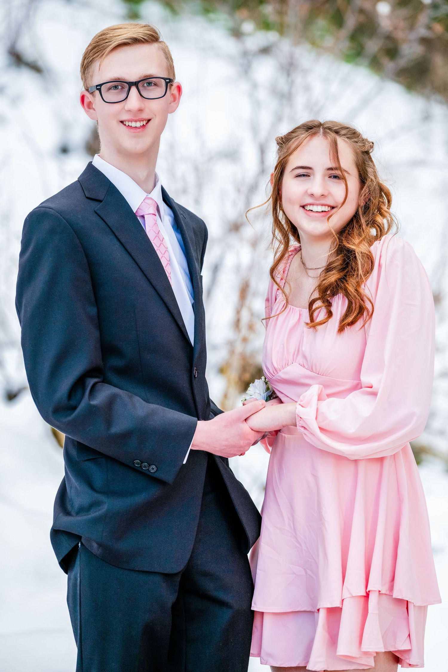 Woods Cross Sweethearts dance couple smiling together in formal attire outdoors with soft natural light