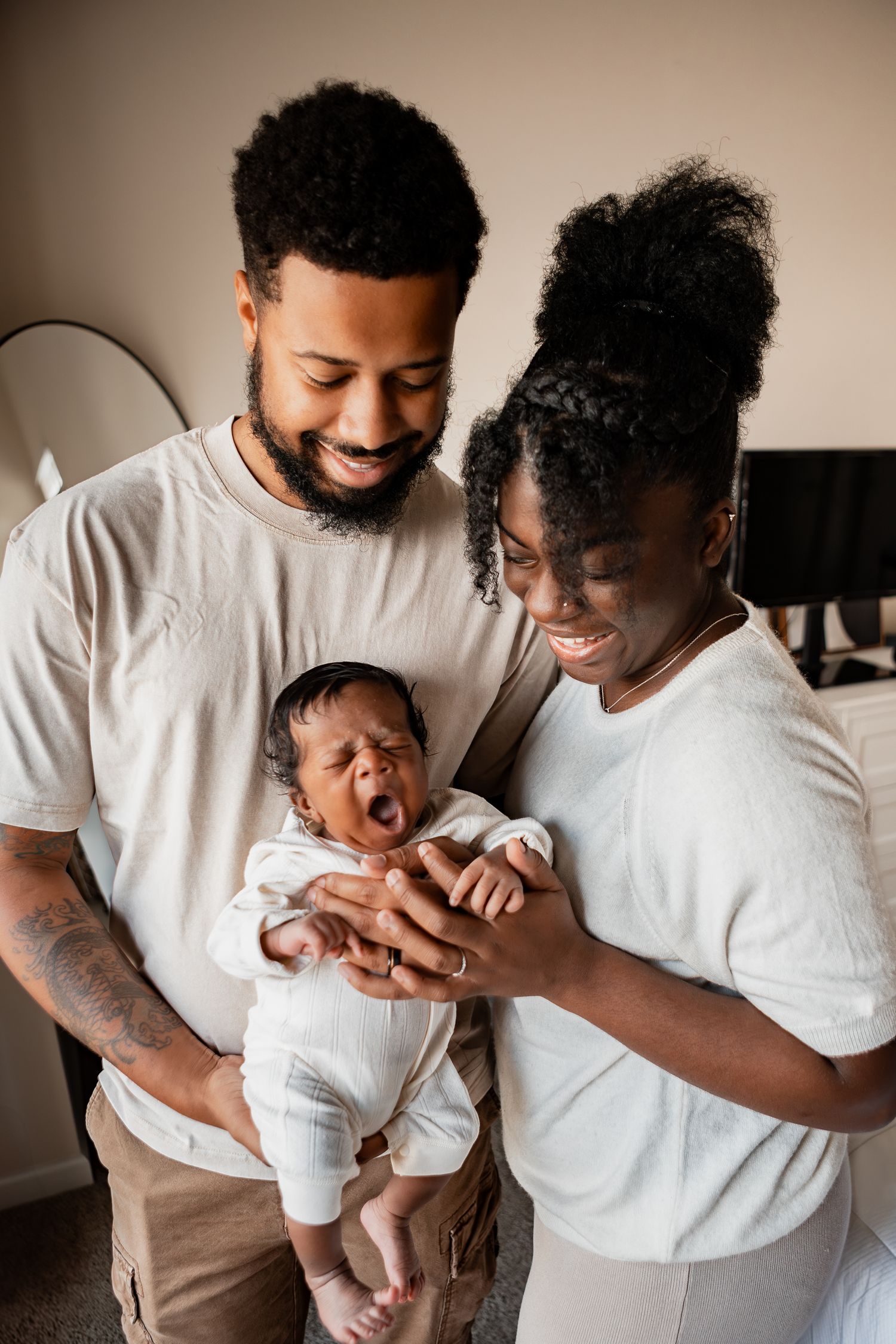 Two people in white shirts share joyful moments with a baby in a candid photo series showing progressive interaction.