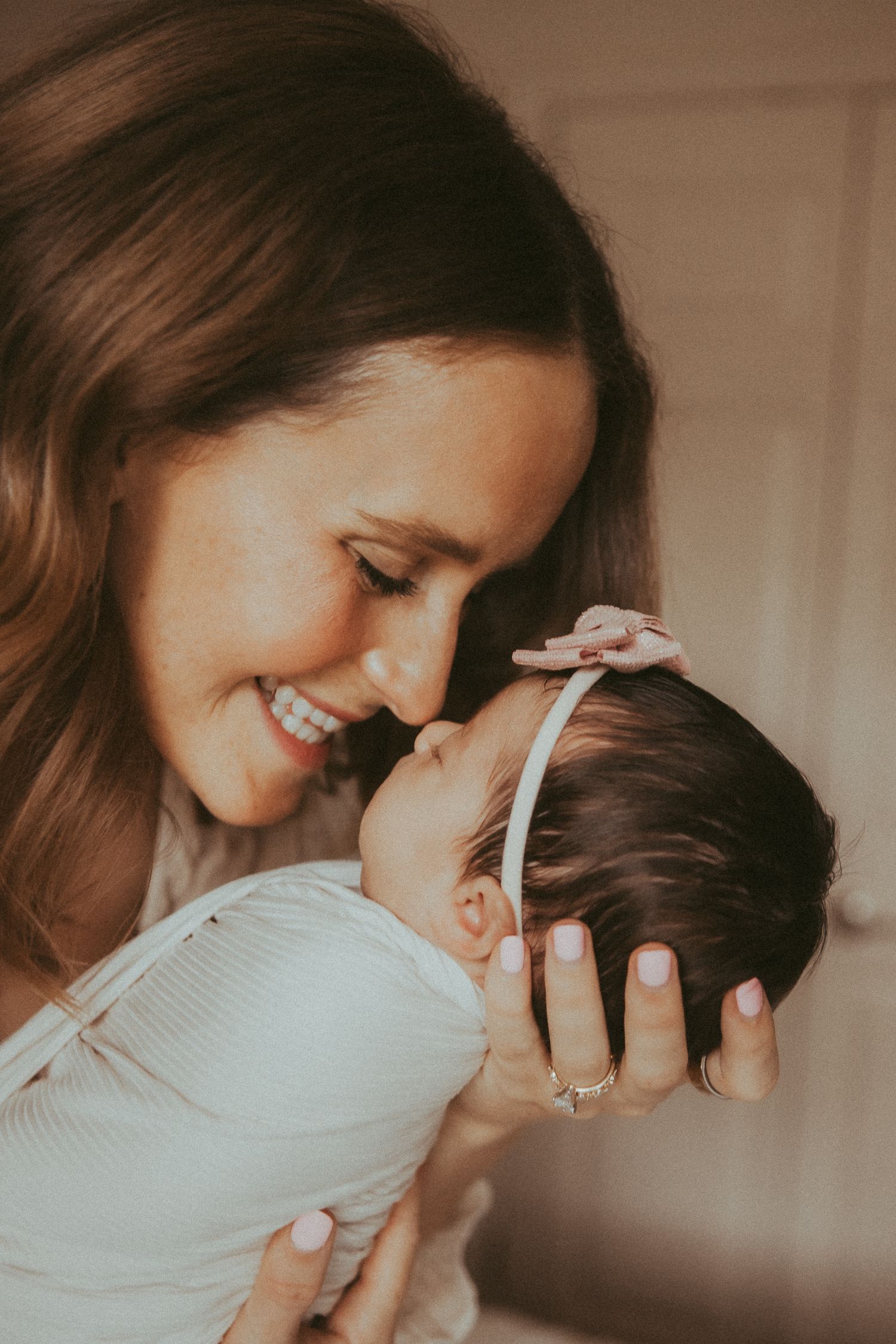 A tender moment between mother and child captured in a warm-toned sequence of intimate portraits.