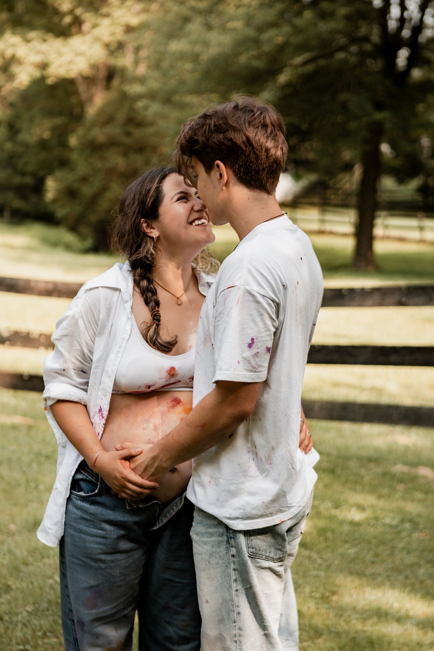 Candid outdoor photo sequence showing tender family moment in sunny park setting.