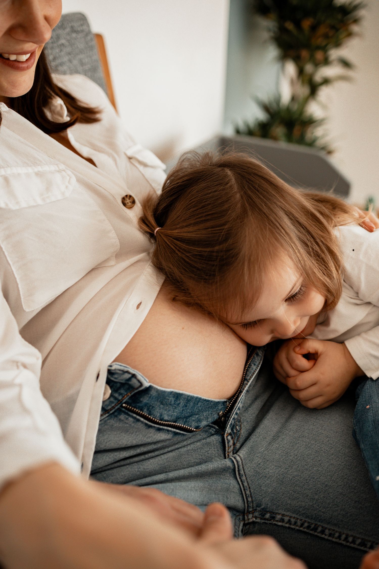 Intimate couple photography series showing tender moments in soft natural light and denim.