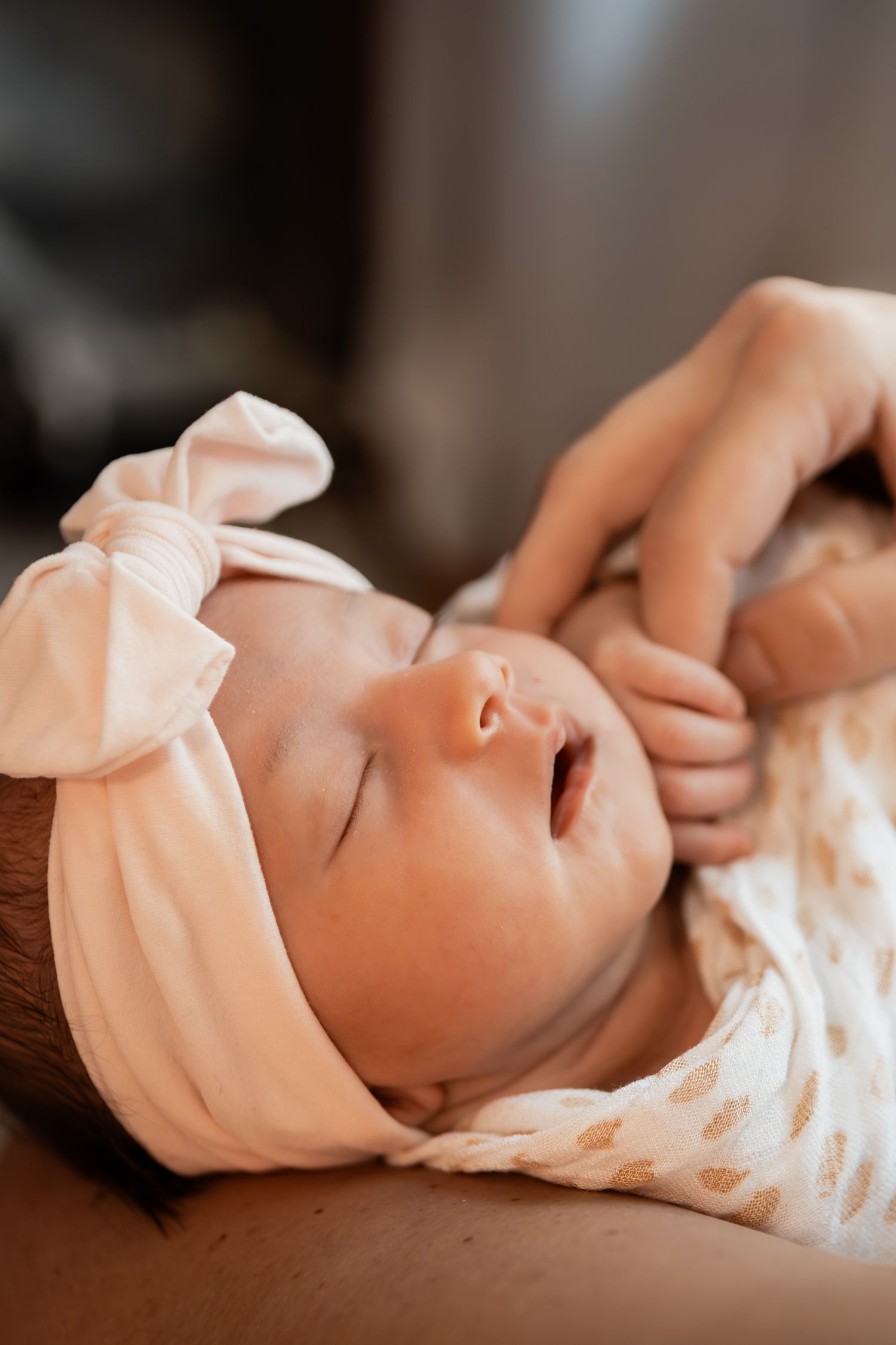 Six sequential macro shots capture the delicate details of a baby doll's face against a soft neutral background.