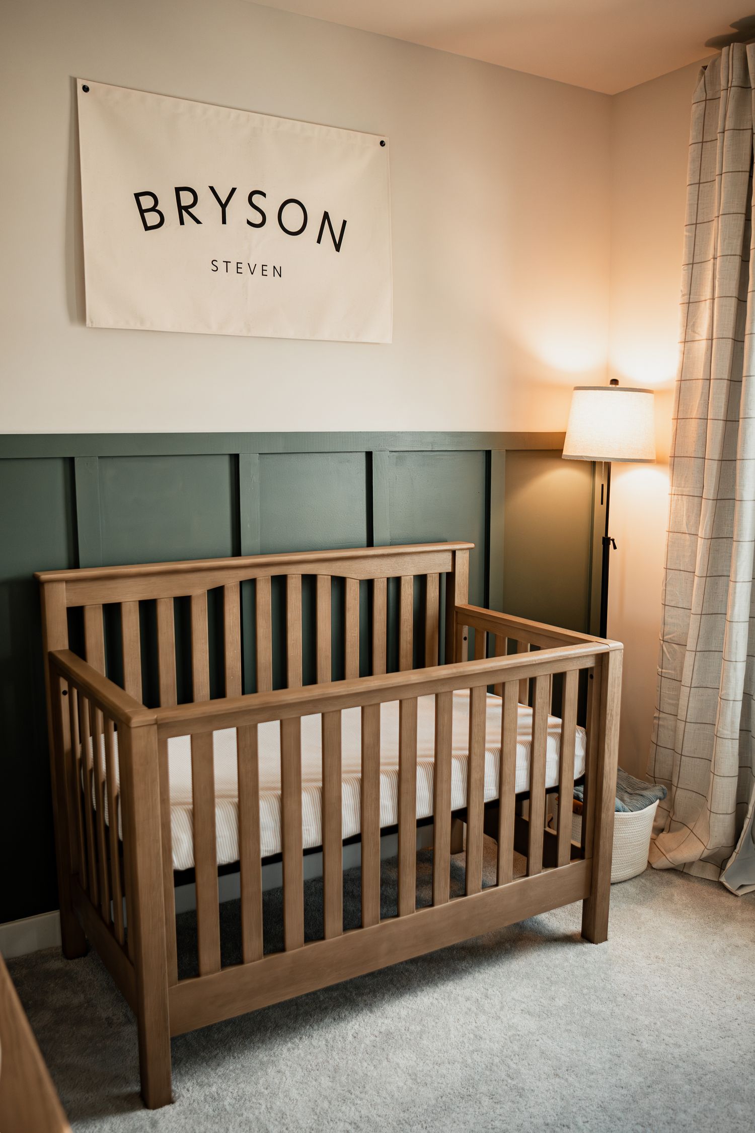 A collage showing four views of a wooden brown crib or bed frame against a gray wall with name art displayed above.