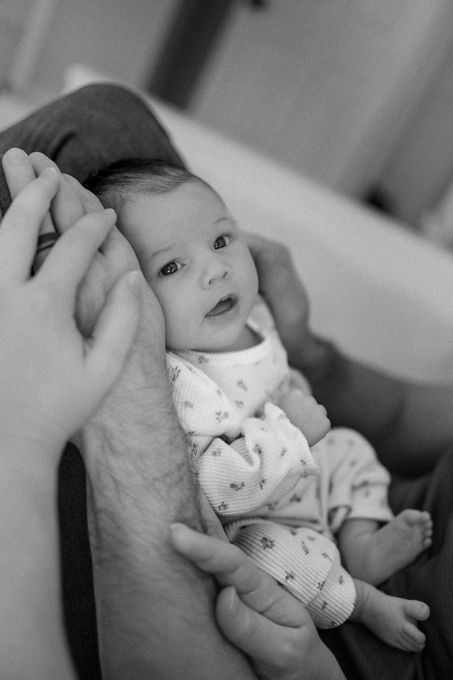 Black and white photo series showing a baby receiving oral medication through a dropper or syringe.