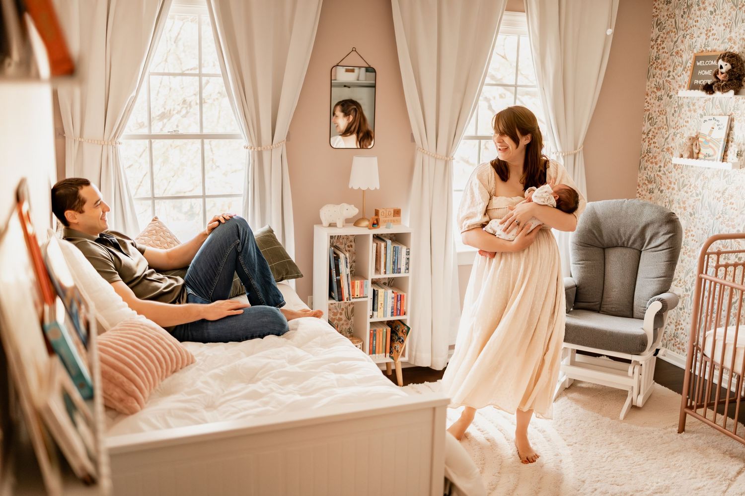A collage of warm-toned interior photos showing a nursery room with natural light and soft pink accents.