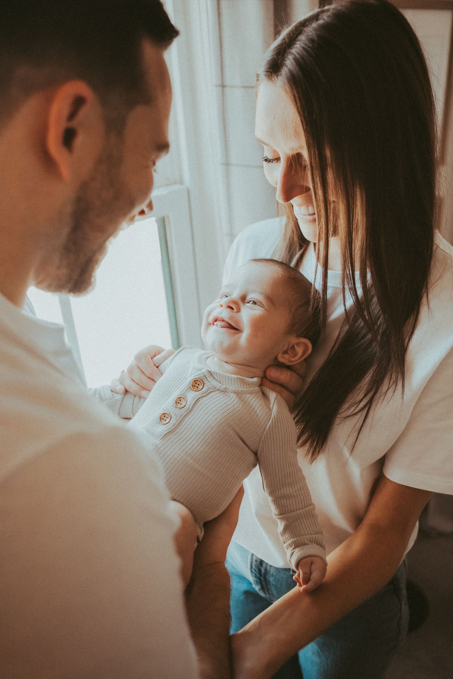 Intimate family photography session showing tender moments of connection and love.