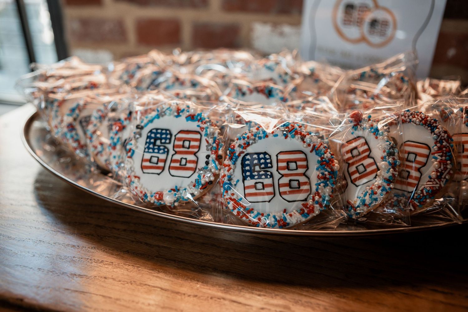 Individually wrapped candy bars scattered on a wooden surface create an appealing display of sweet treats.