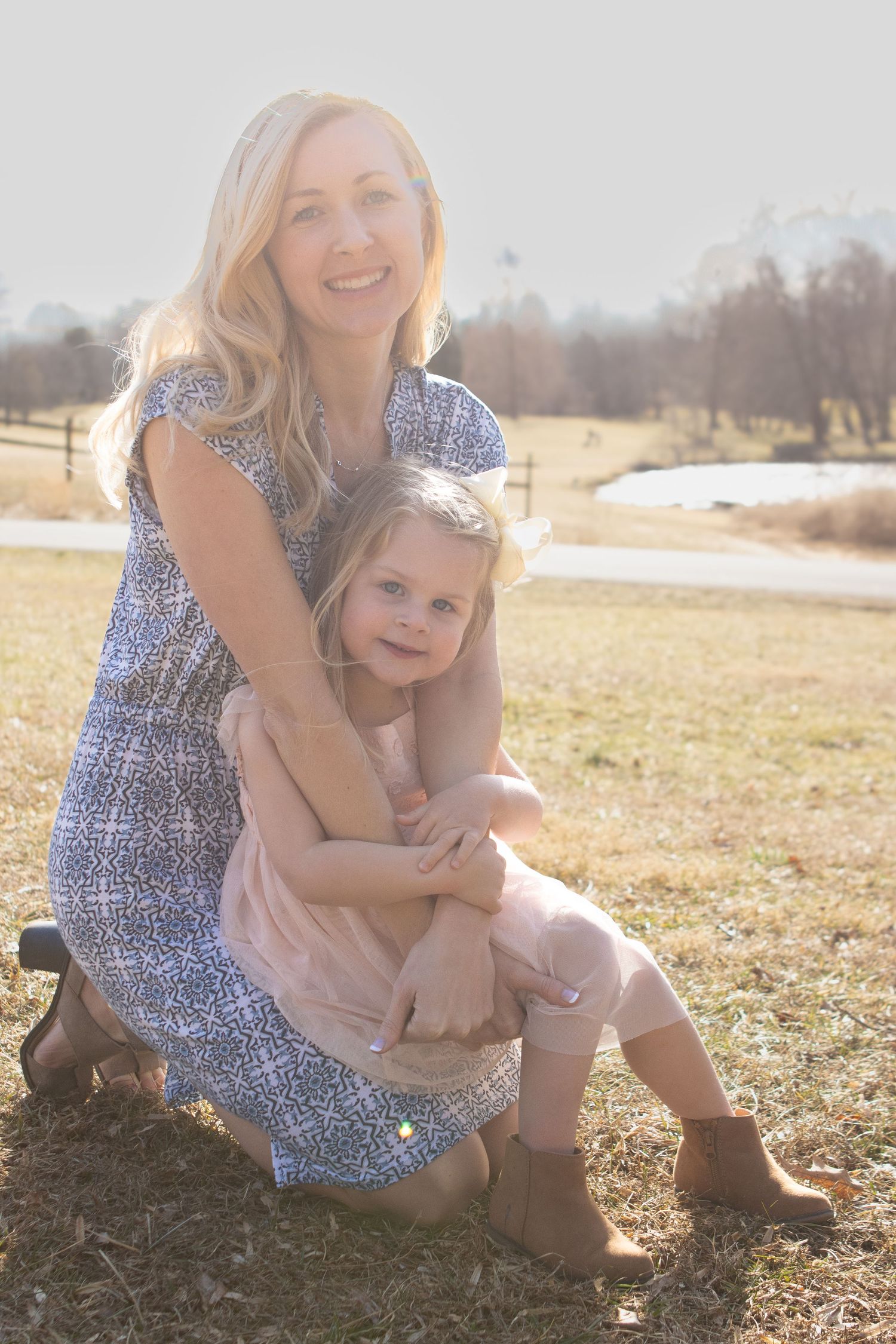 An intimate outdoor portrait showing connection and affection in natural lighting.