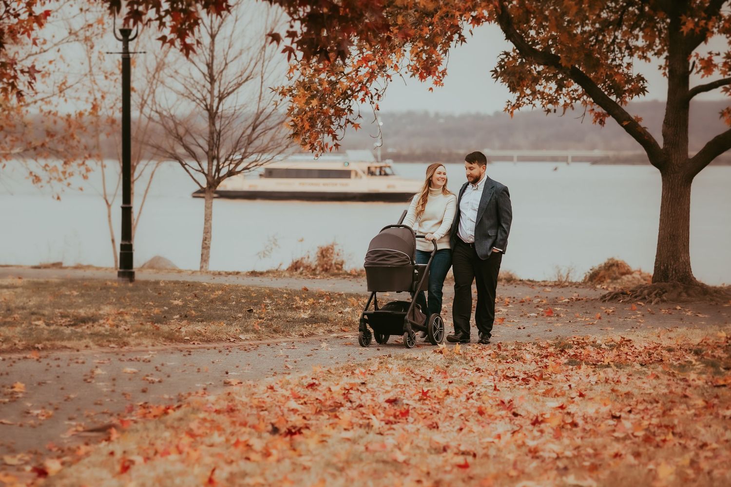 A romantic autumn engagement photoshoot sequence showing a couple walking and embracing among fallen leaves by a lake.