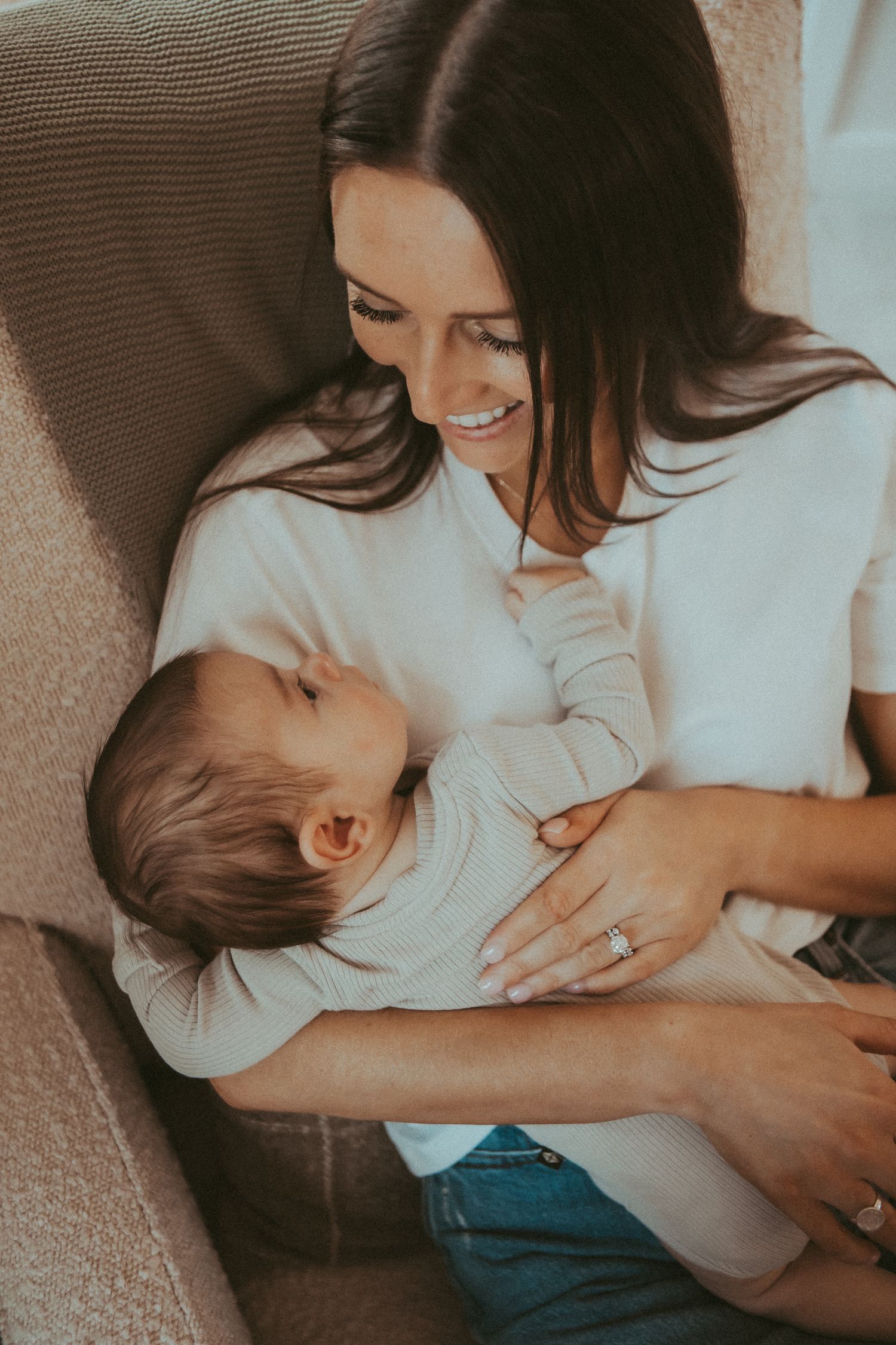 Intimate nursing moments captured in a series of warm-toned photographs showing mother and baby.