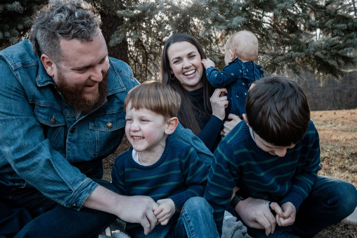 A series of candid family photos showing playful moments and laughter outdoors in winter clothing.