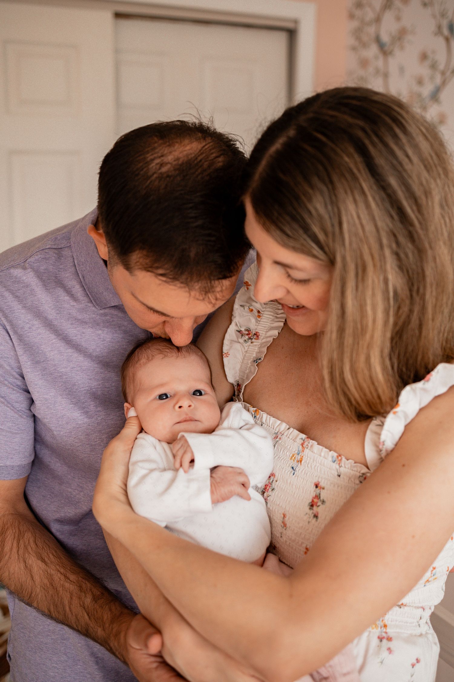 Parents sharing loving moments with their newborn baby in a sequence of intimate family portraits.