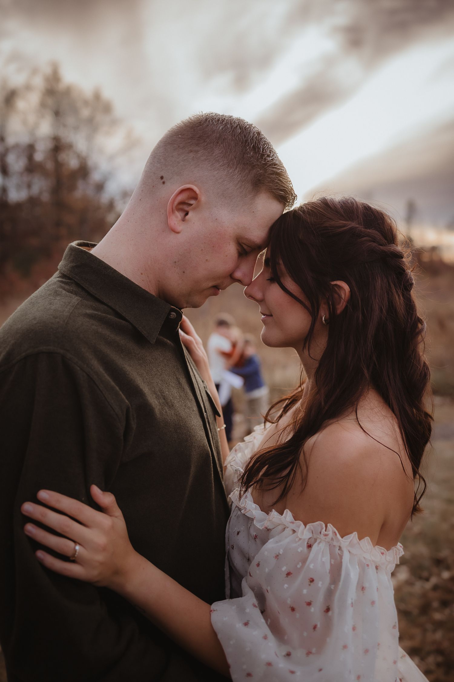 A romantic wedding couple shares intimate moments in a series of close-up shots outdoors at sunset.