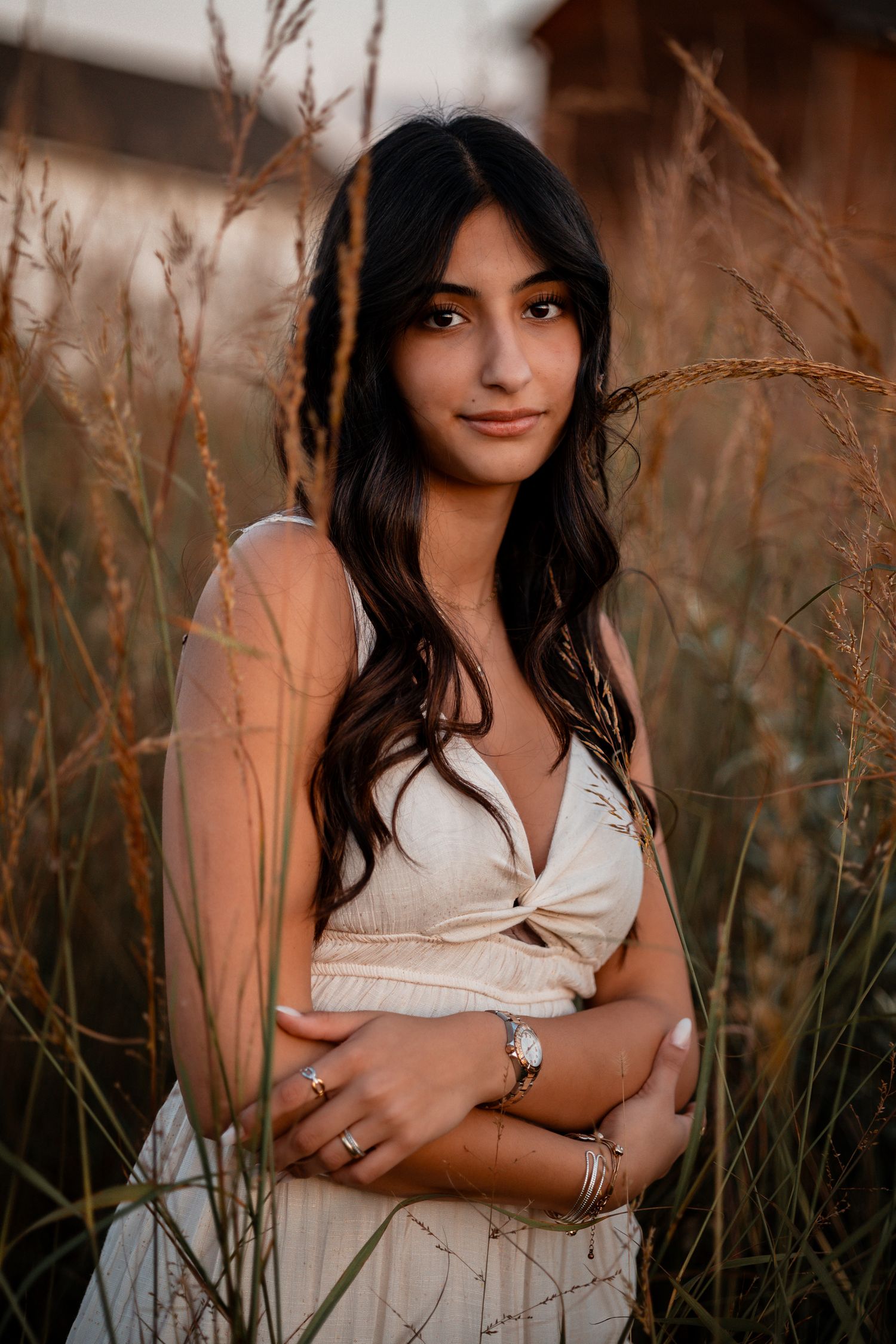 Artistic portrait series with someone in white among tall wheat stalks during sunset.