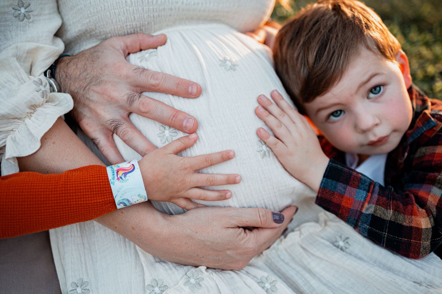 Close-up shots of hands touching and holding in a gentle sequence showing connection and tenderness.