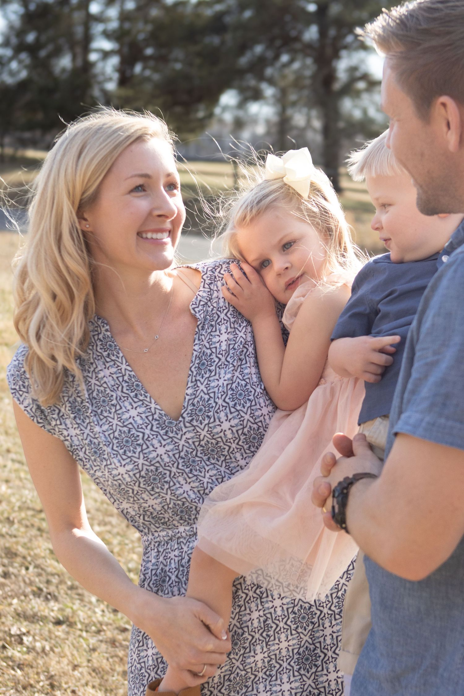 Intimate family moment captured in golden afternoon light.