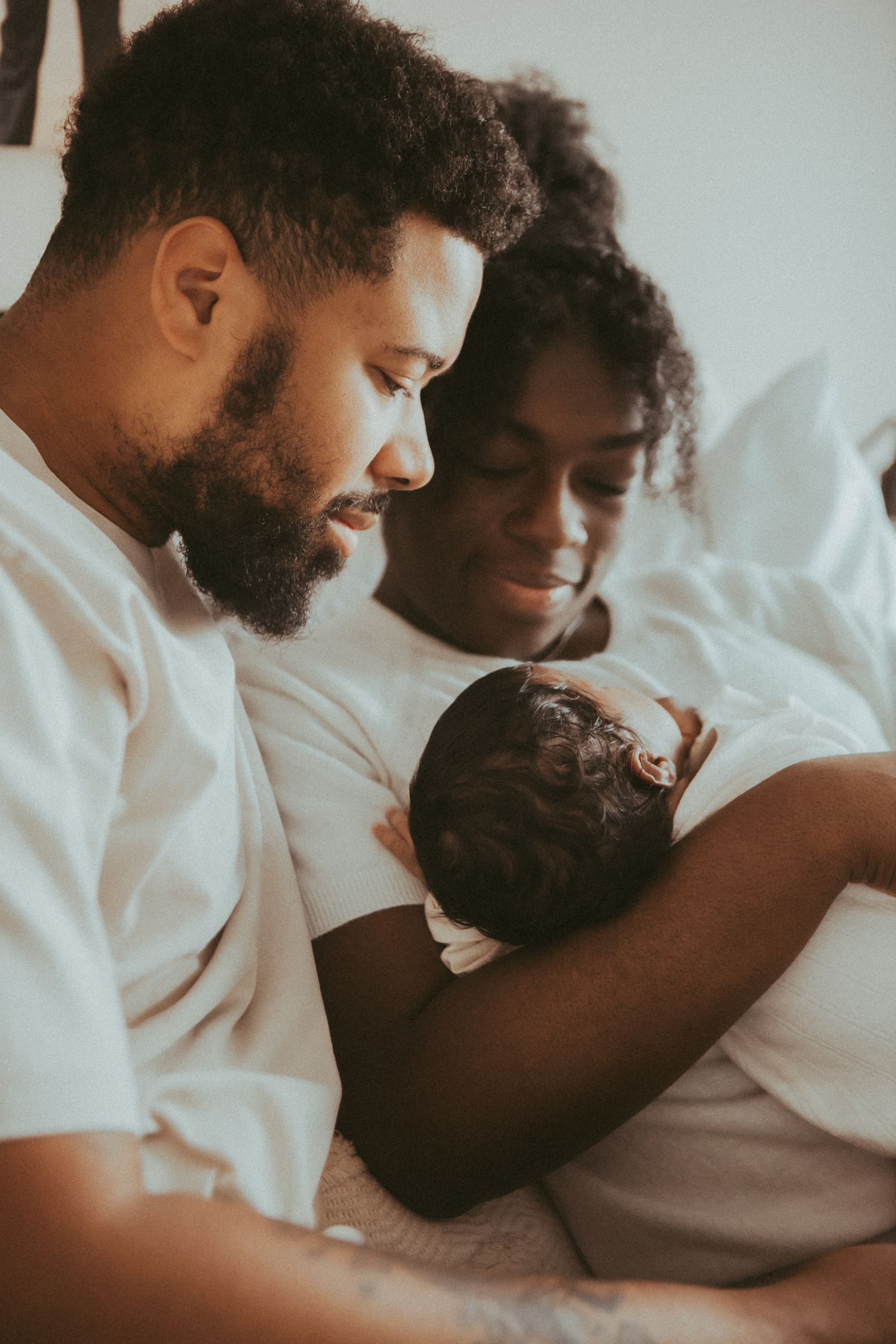 Parents bonding with their newborn baby in a series of tender moments.