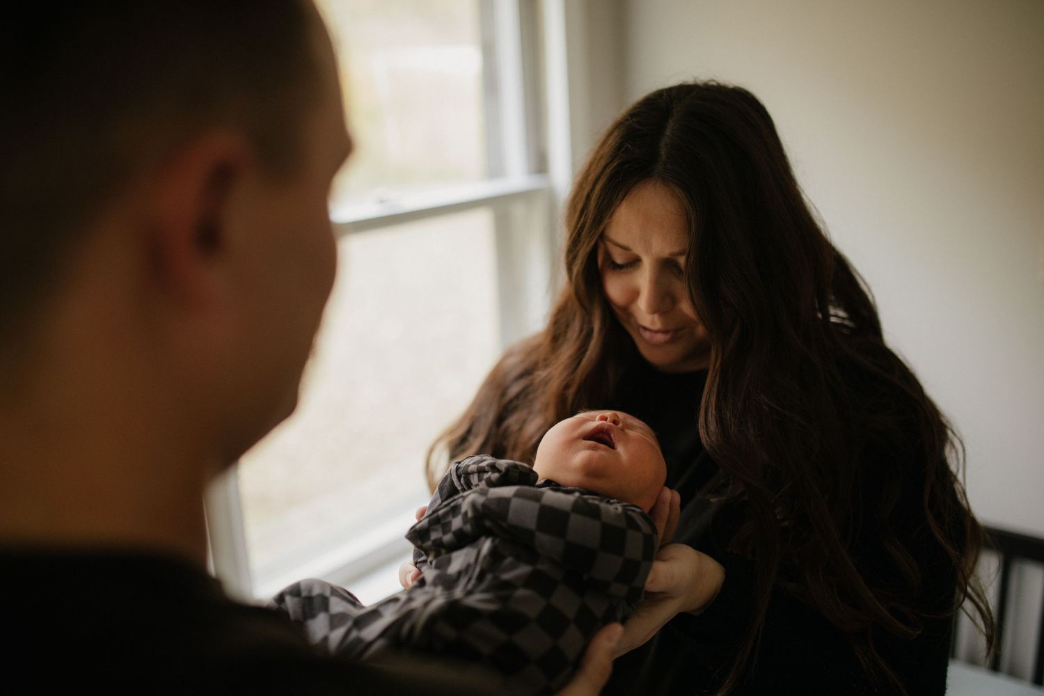 A tender family moment captured in warm lighting at home.