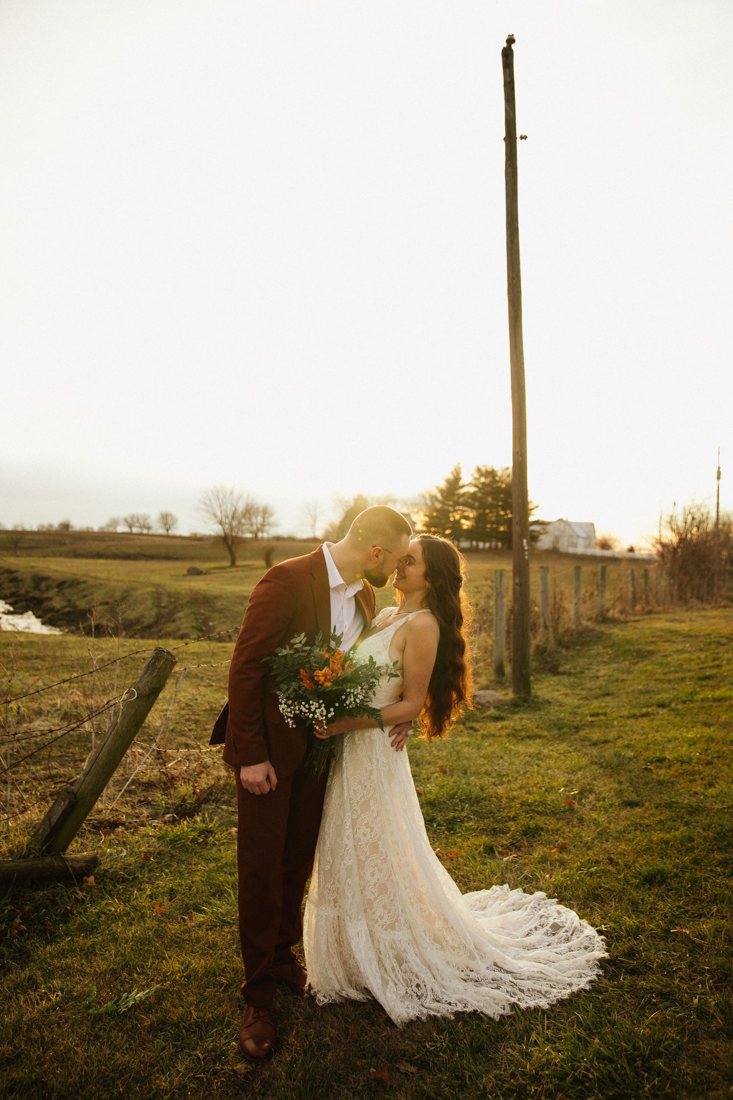 Golden hour wedding photography in a rustic countryside setting.