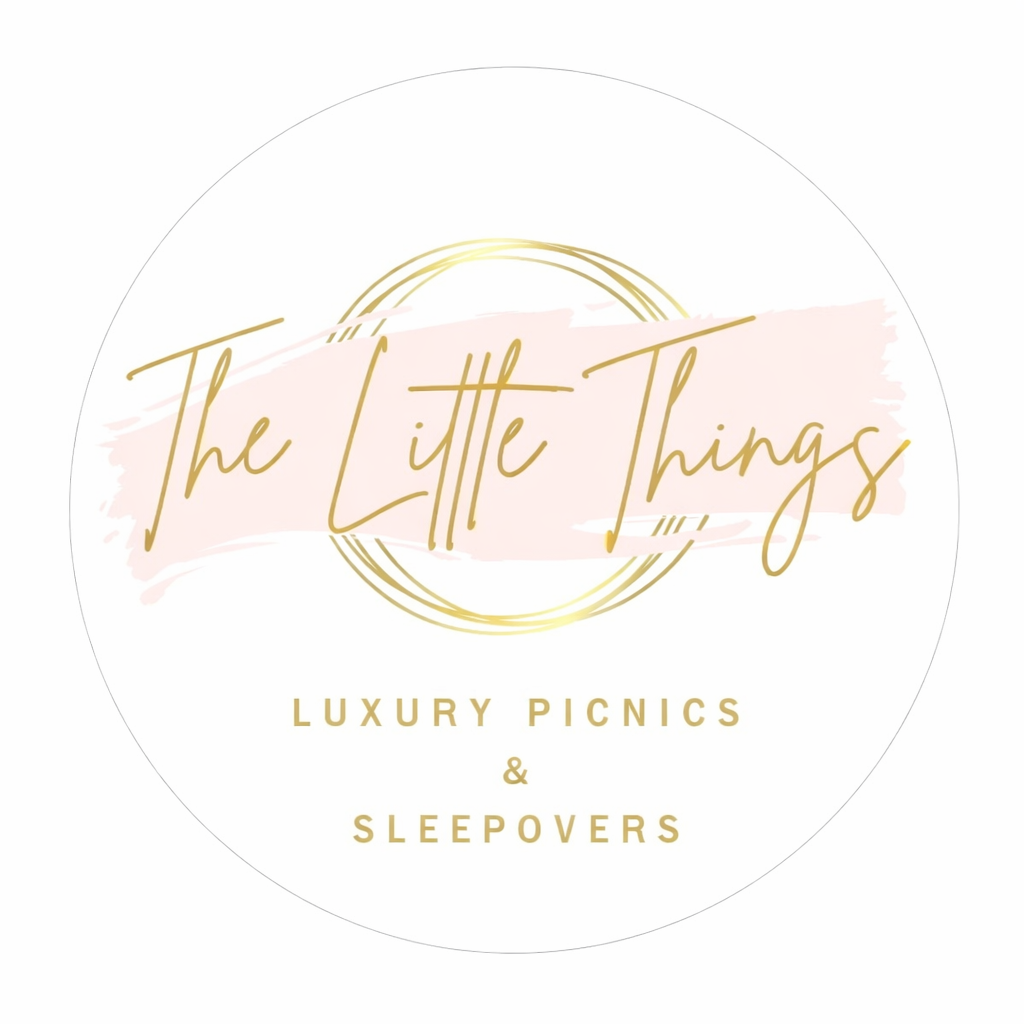 Elegant gold text logos for luxury picnics and sleepovers with eye icon design elements on a pale pink background.