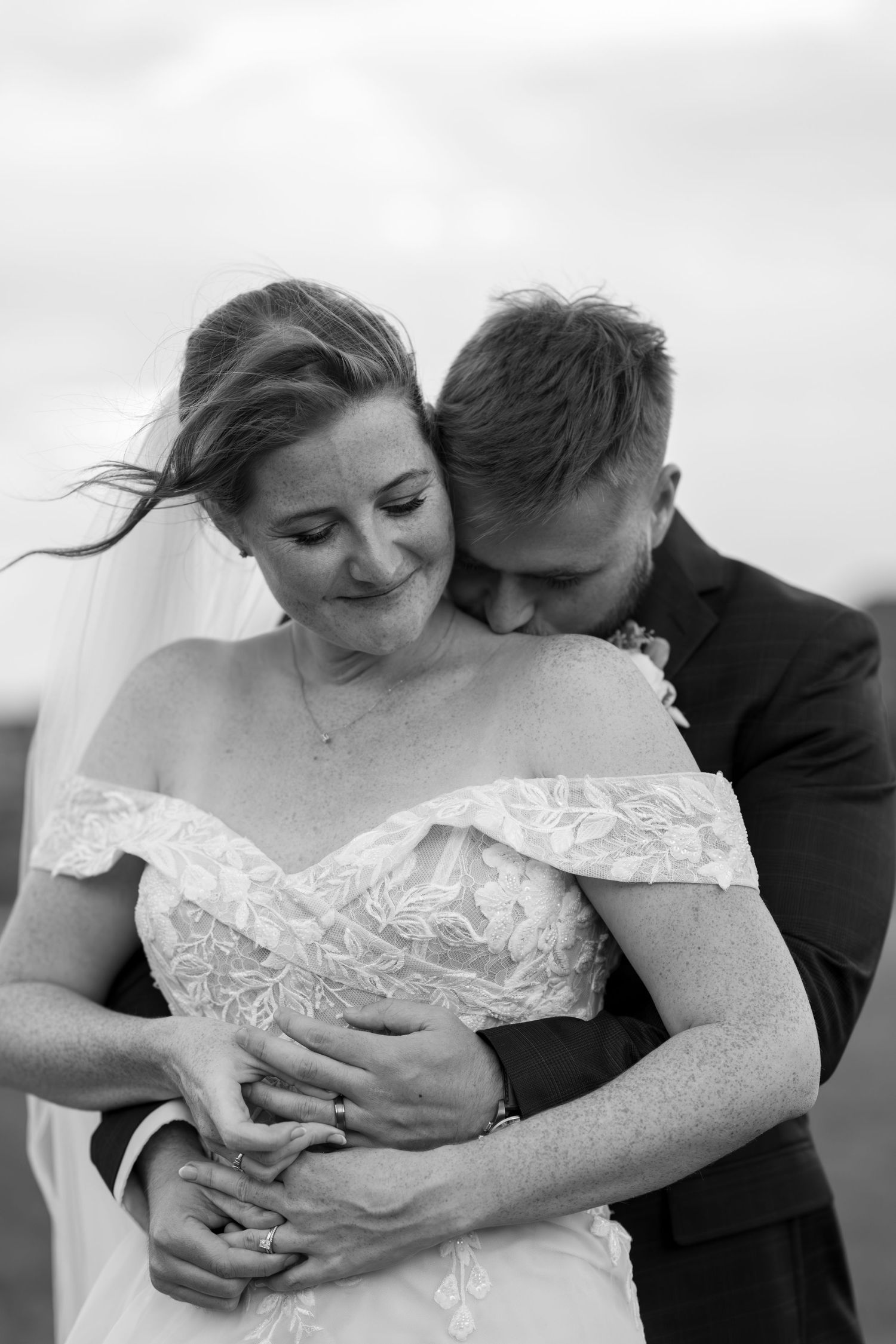 A romantic black and white sequence showing tender moments between a couple in wedding attire.