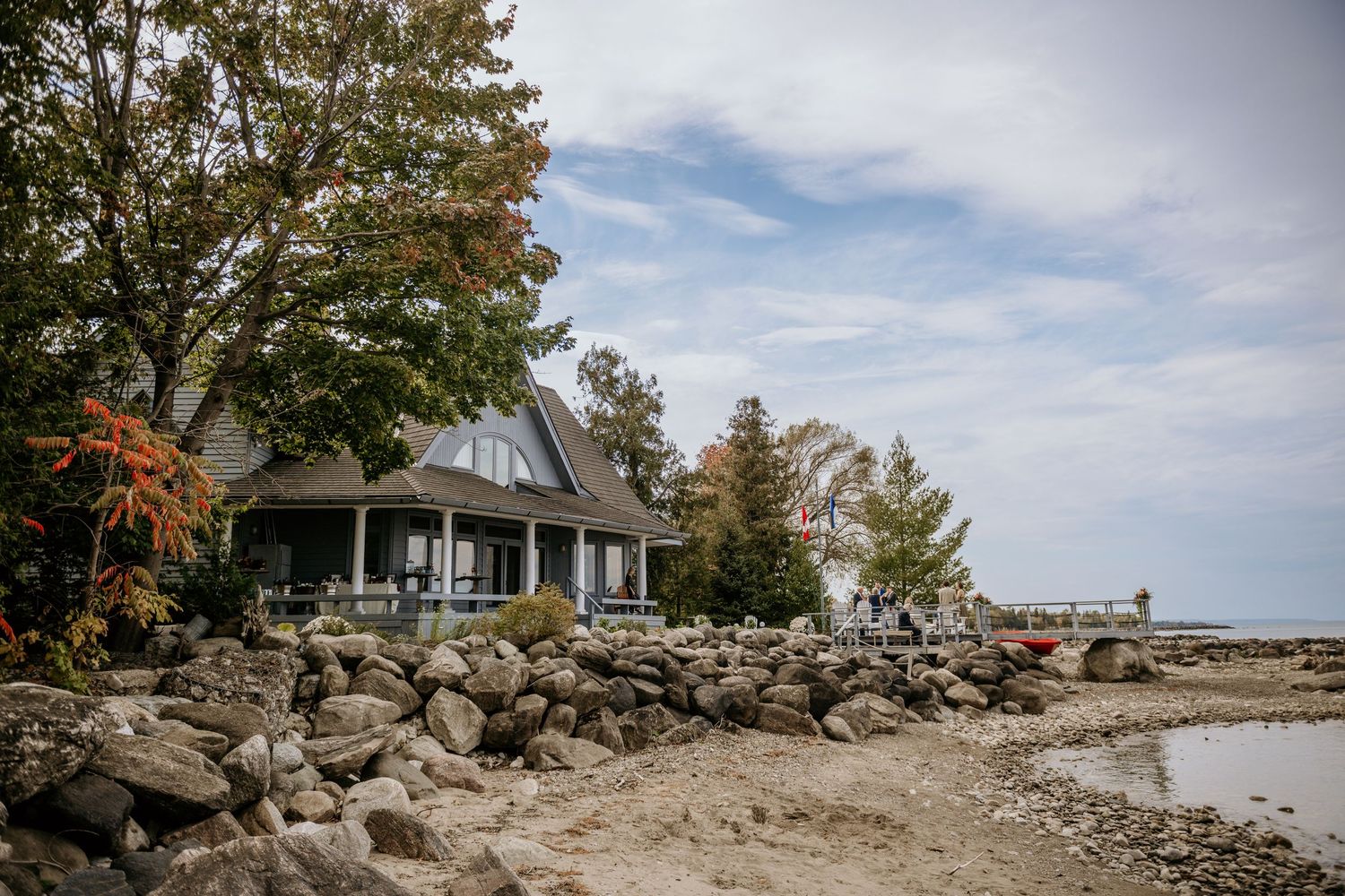 A series of images showing a scenic lakeside property with stone walls and natural landscaping.