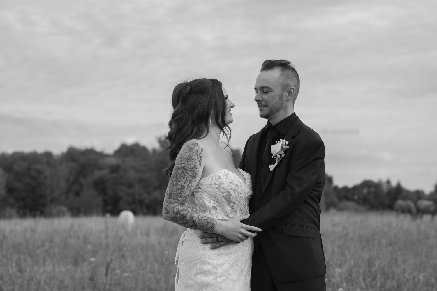 Black and white wedding portraits captured in an outdoor setting.