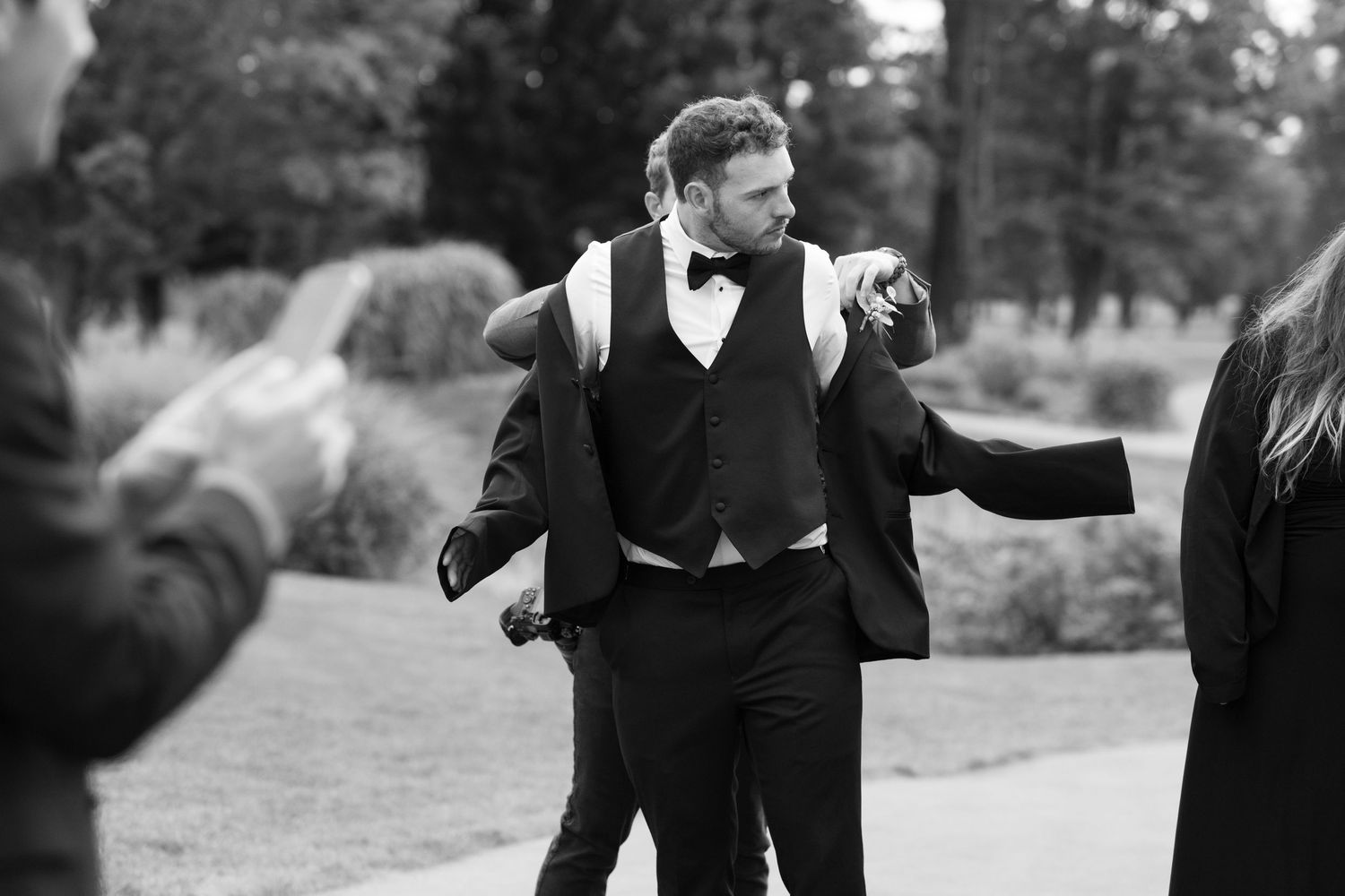 A black and white photo collage shows people dancing and celebrating at what appears to be a wedding reception.